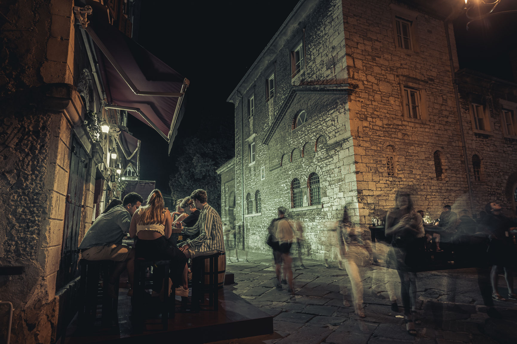 People are passing by in Pula, Croatia
